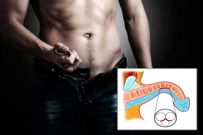 l'uomo apre la cerniera per gli esercizi di ingrandimento del pene